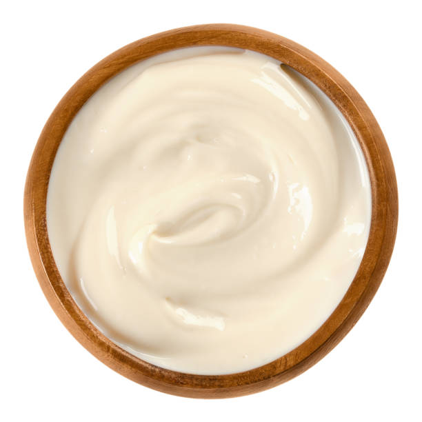 istock Mayonnaise in wooden bowl over white 640980506