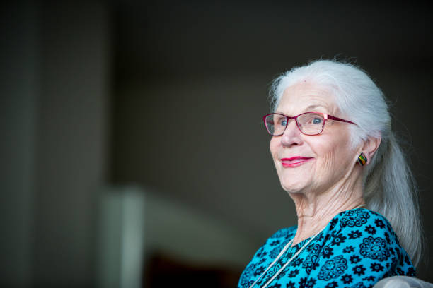 istock Senior woman looking out the window 640980830