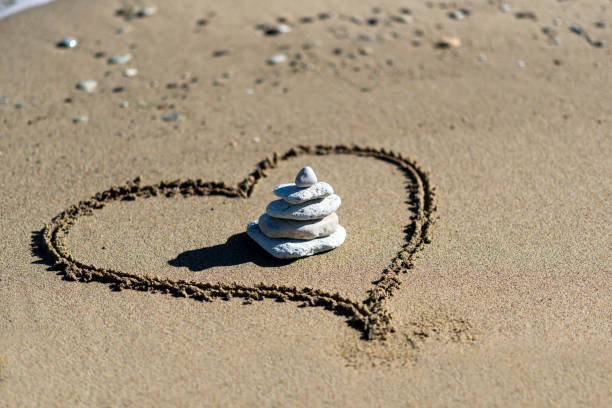 istock Heart on beach with stones 640980900