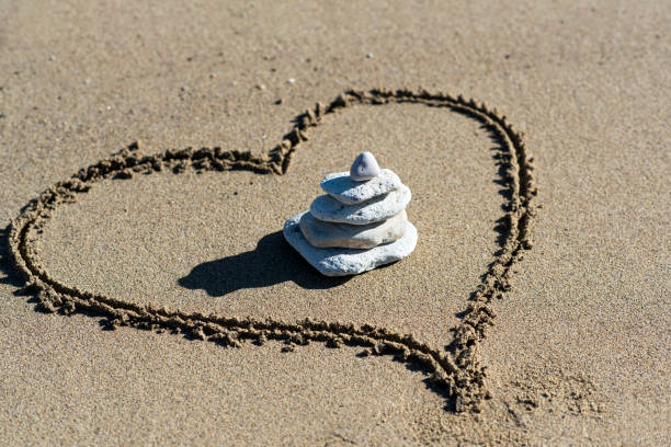 istock Heart on beach with stones 640981354