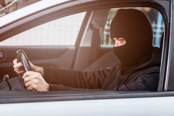 istock Auto thief driving a stolen car 640984034