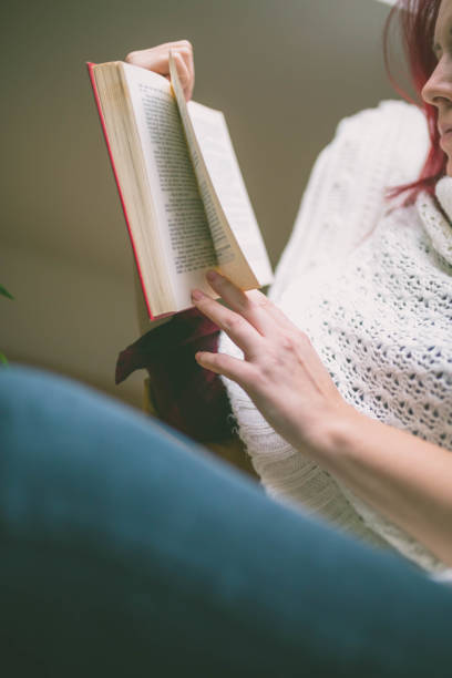 istock Attractive red-haired woman drinking cup of coffee 640984468