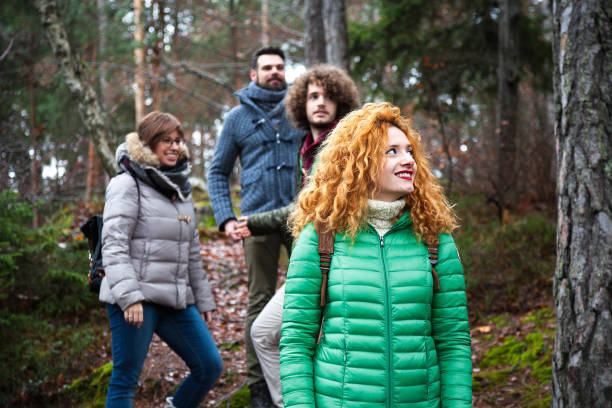 istock Group of friend walking into wood 640985236