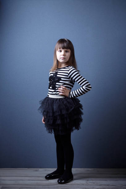 istock Cute girl wearing skirt posing 640986530