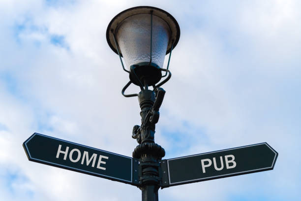 istock Home versus Pub directional signs on guidepost 640988022