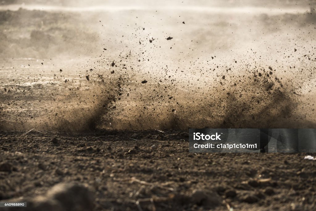 dirt fly after motocross roaring by Mud Stock Photo