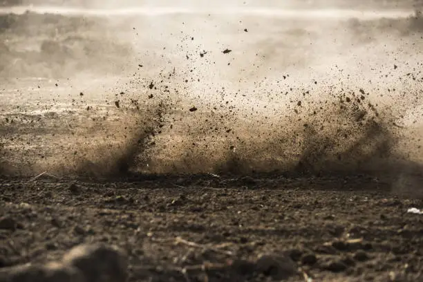 Photo of dirt fly after motocross roaring by