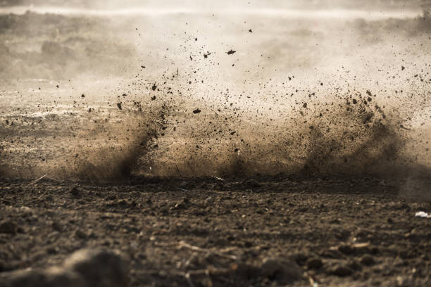 dirt fly after motocross roaring by - motorcycle racing imagens e fotografias de stock