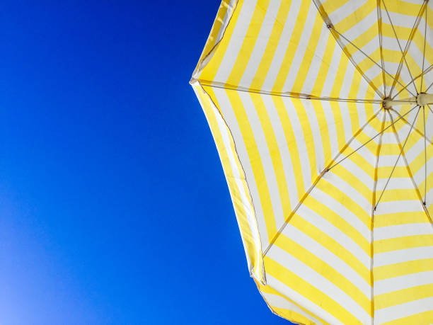 istock Colorful parasol against blue sky 640991542