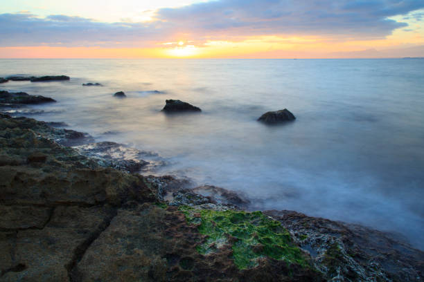 istock Sea coast in a long exposure shot, with blurred water 640992882