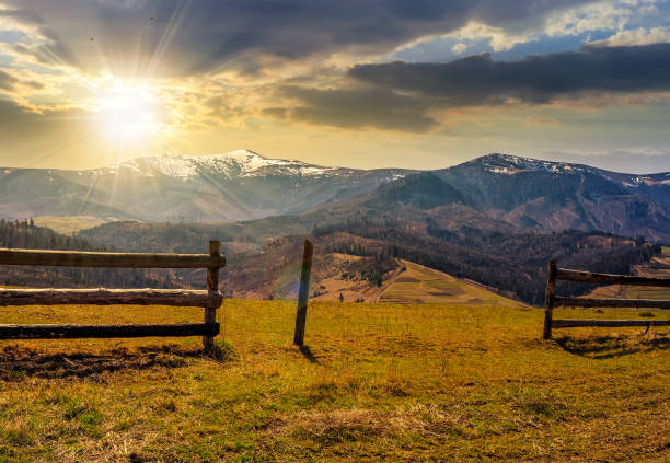 istock fence on rural field in spring at sunset 640998108