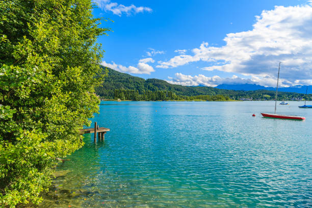 View of Worthersee lake in summer landscape of Alps Mountains, Austria Most popular lake in Austria for summer holidays pörtschach am wörthersee stock pictures, royalty-free photos & images