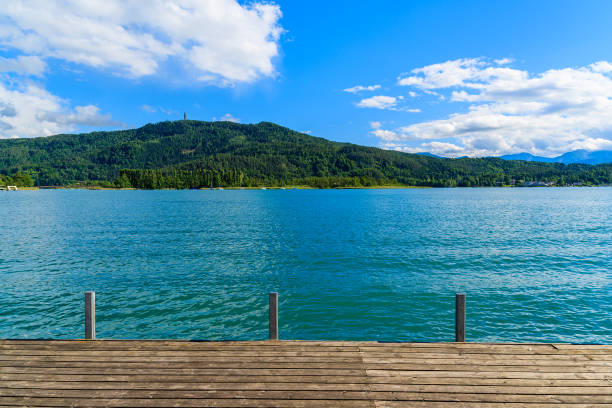 Promenade along Worthersee lake in summer time, Austria Most popular lake in Austria for summer holidays pörtschach am wörthersee stock pictures, royalty-free photos & images