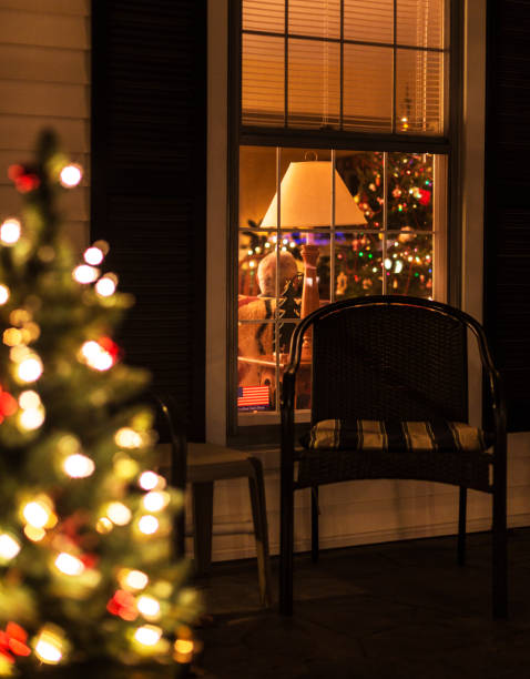 Small pretty Christmas lights in star shape at the window