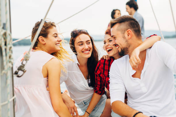 istock Happy friends on a yacht 641001636