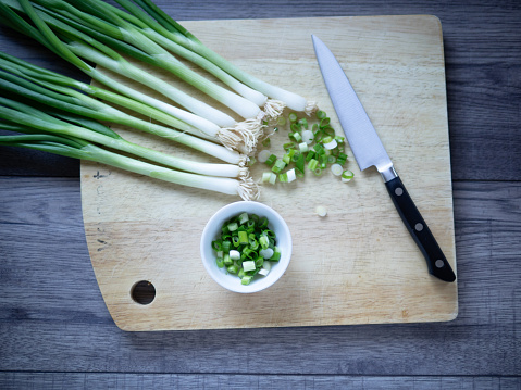 Organic cos romaine lettuce cutting on wooden board, Food ingredient for healthy salad