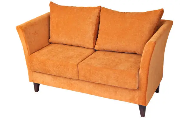 Two seater fabric couch with orange color, isolated on white, clipping path saved.