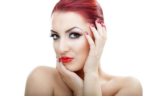Pretty red haired girl posing with her makeup