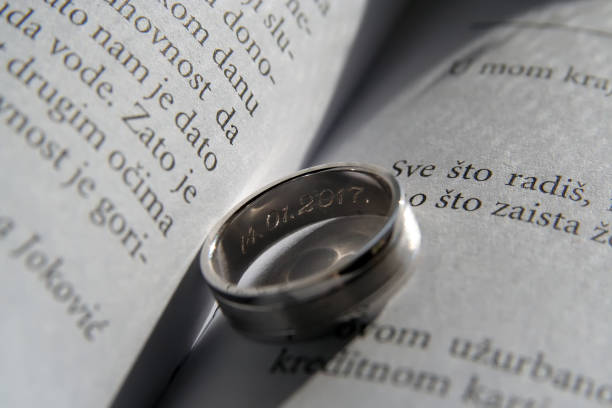 istock Wedding Rings on a book. White gold Wedding Rings on a book. 641008680