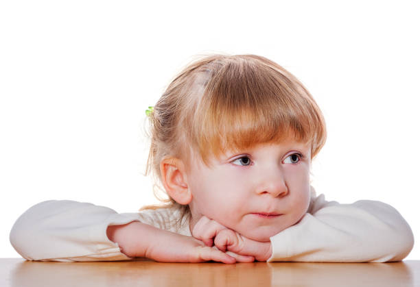 Close-up portrait of a sad little girl.