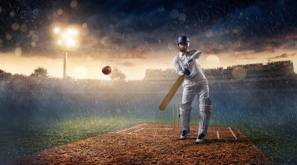 istock Cricket: Batsman on the stadium in action 641011828