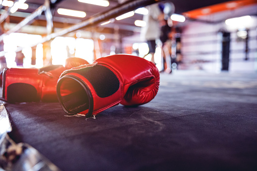 Modern gym facility in Bangkok, boxing gloves close up.