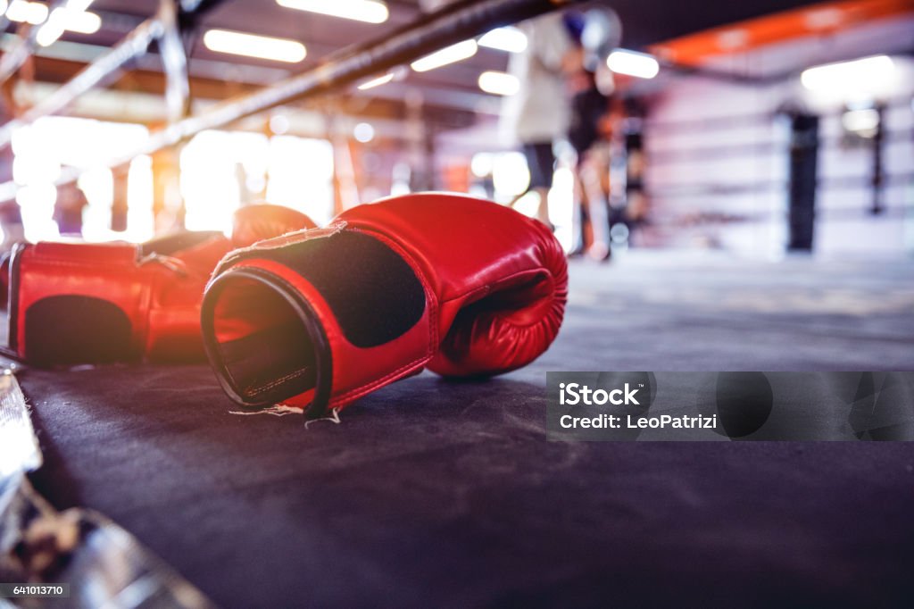 Muay Thai workout - boxing gloves close up Modern gym facility in Bangkok, boxing gloves close up. Boxing - Sport Stock Photo