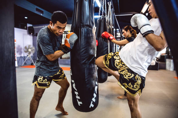 istock Muay Thai workout - Motivational training at the gym facility 641015146