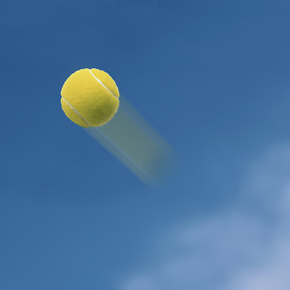 Tennis ball flying into the sky