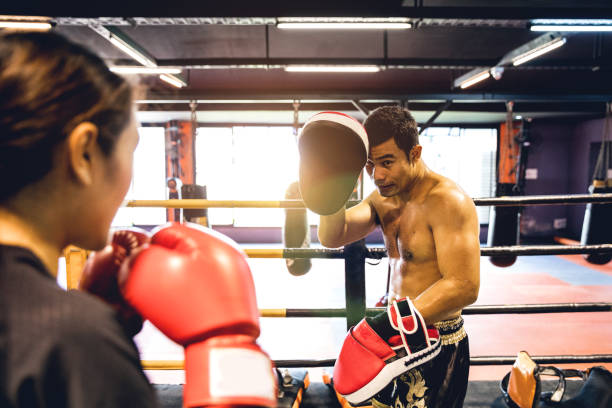 istock Muay Thai workout - Motivational training at the gym facility 641016898