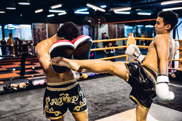 istock Muay Thai match on boxing ring in Thailand 641017216