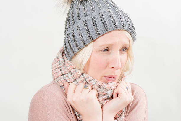 istock Lady In Scarf and Winter Hat Chilling Cold 641018856