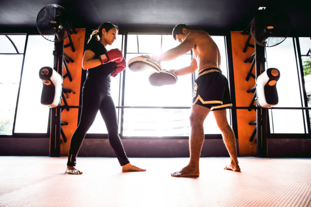 istock Muay Thai workout - Motivational training at the gym facility 641018906