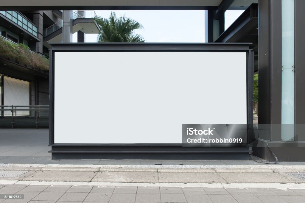 Large Billboard in the City Street, Banner - Sign, Lighting Equipment, Billboard, Advertisement,Large blank billboard on a street wall,  banners with room to add your own text Billboard Stock Photo
