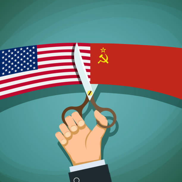 istock Human hand with scissors cuts the USA flag and the USSR. 641022914