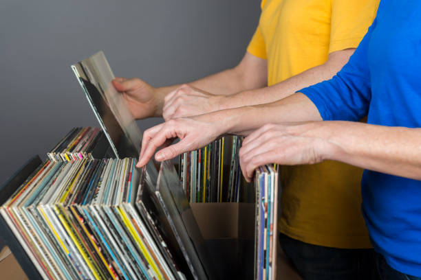 istock couple searching records in a music store 641024272