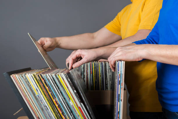 istock couple searching records in a music store 641024424