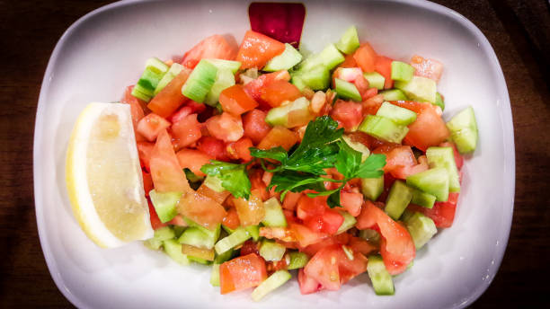 istock Turkish Coban salata or Shepherds salad in white bowl. 641025838