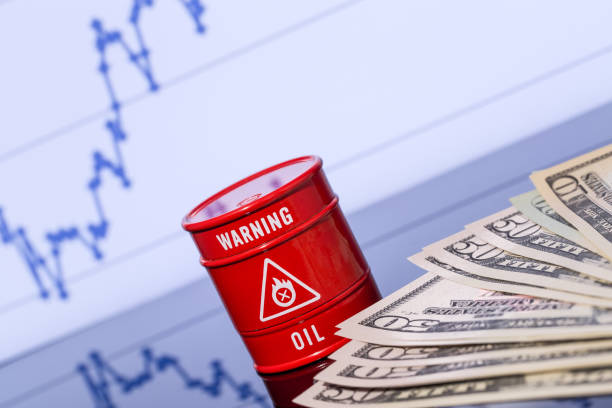 barrel of oil, dollars on blue chart stock photo