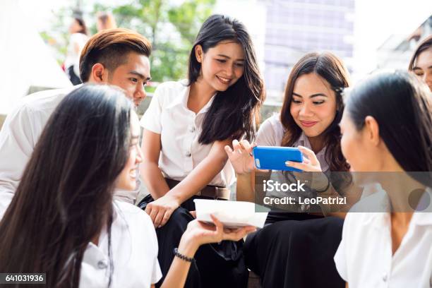 Students At Lunch Break Eating Take Away Food Stock Photo - Download Image Now - 20-24 Years, Adult, Asia