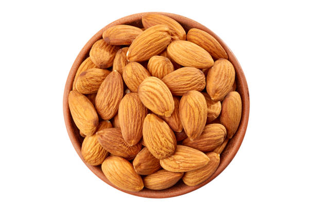 istock Peeling almond in ceramic bowl on white 641033884