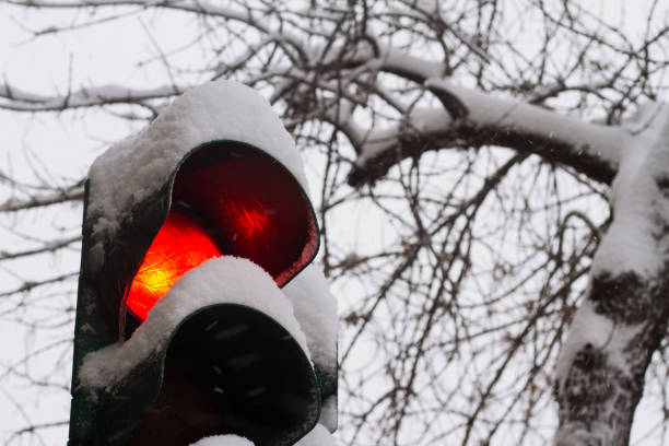 istock close up of red traffic light covered in snow 641036634