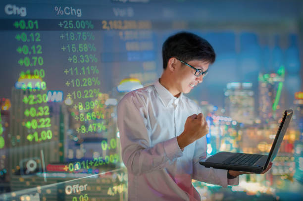 istock Businessman using a laptop on the rooftop of a skyscraper 641038782