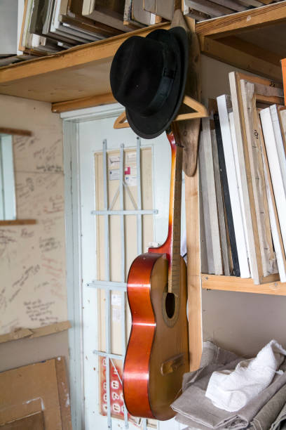 istock Guitar and hat in the artist's Studio 641039254