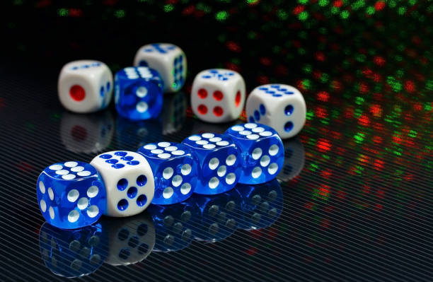 istock blue and white dices on the glossy black background 641040502