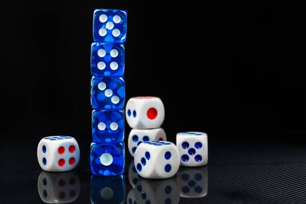 istock blue and white dices on the glossy black background 641040808