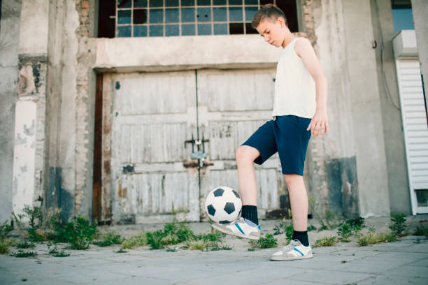 istock Boy with soccer ball. 641041128