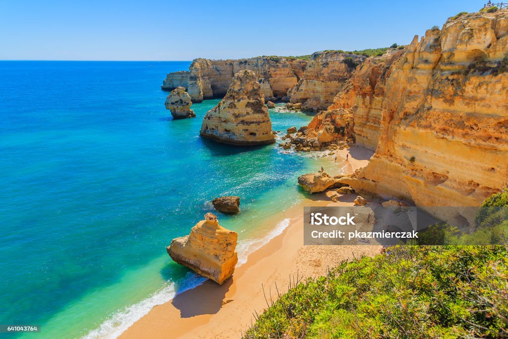 View of beautiful Marinha beach with crystal clear turquoise water near Carvoeiro town, Algarve region, Portugal Algarve region in south of Portugal is very popular tourist destination Algarve Stock Photo