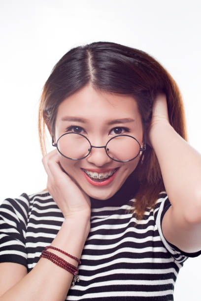istock Young girl with braces 641044094