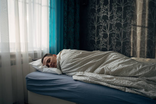 istock Morning. Light from window. Men sleep in bed 641044470